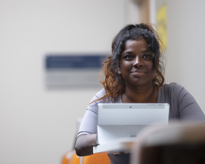 Student sitting with laptop