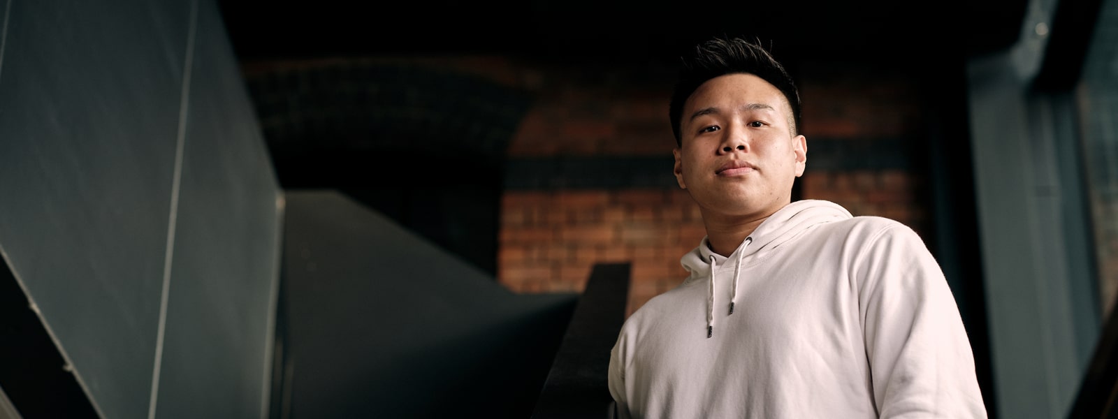 A student standing on a stairway