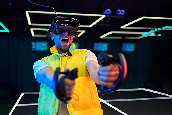 A man wearing a VR headset in the middle of a virtual experience