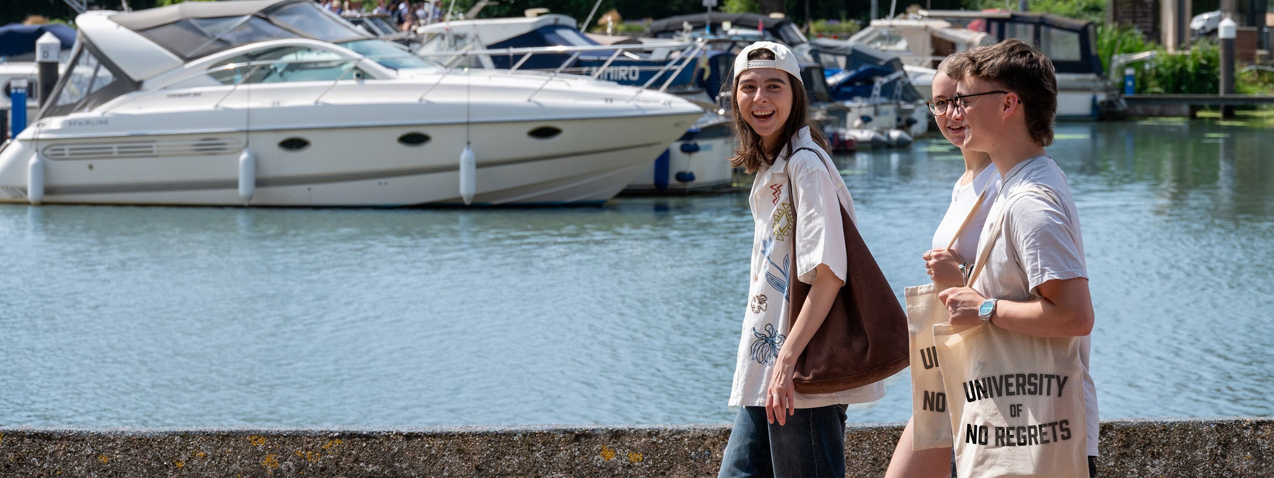 Students walking alongside the Brayford Waterfront