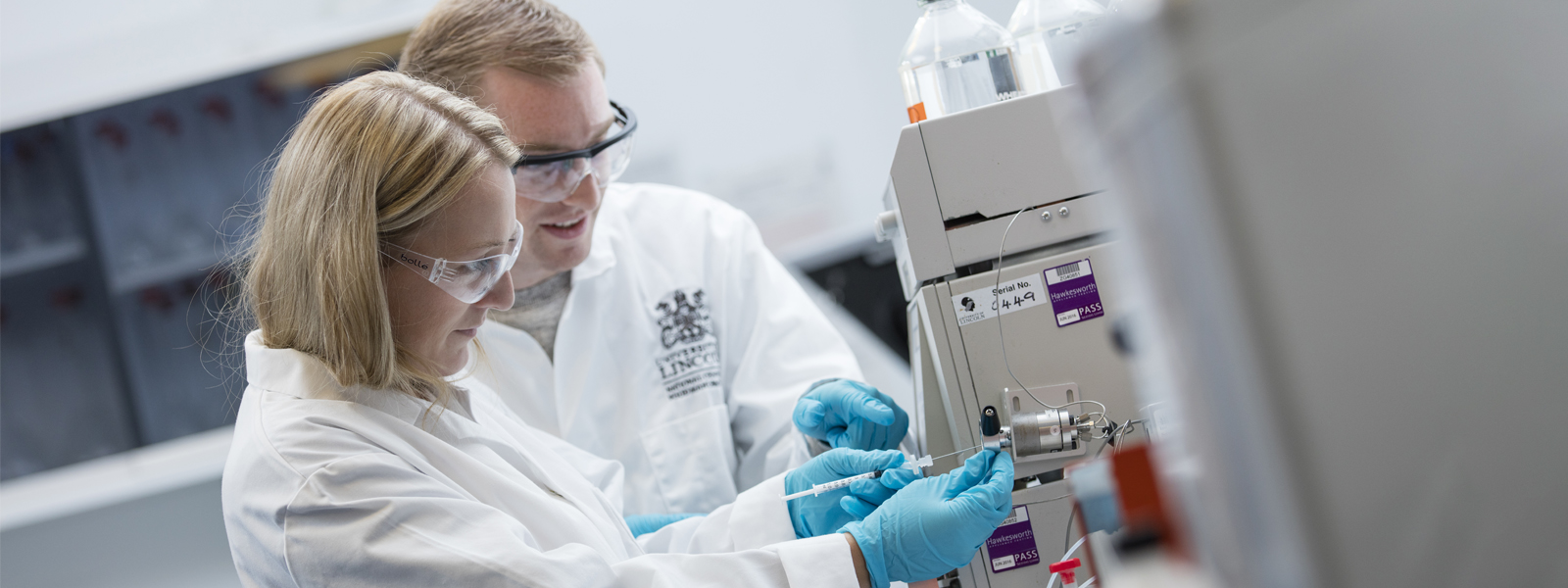 Students working on a machine