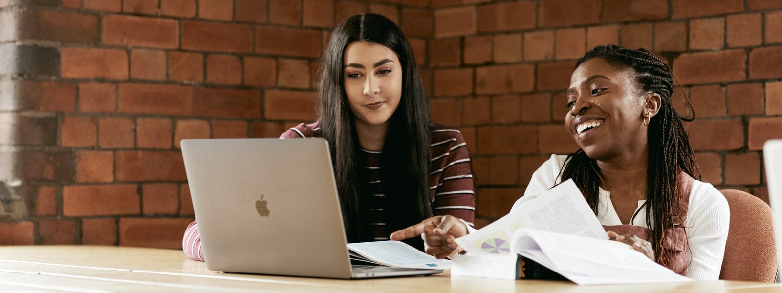 Two female students working.