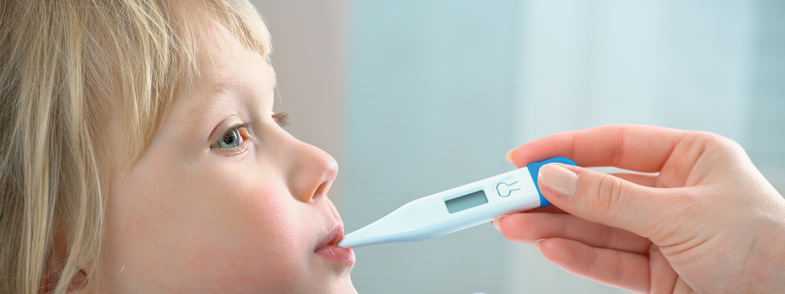 A child with a thermometer