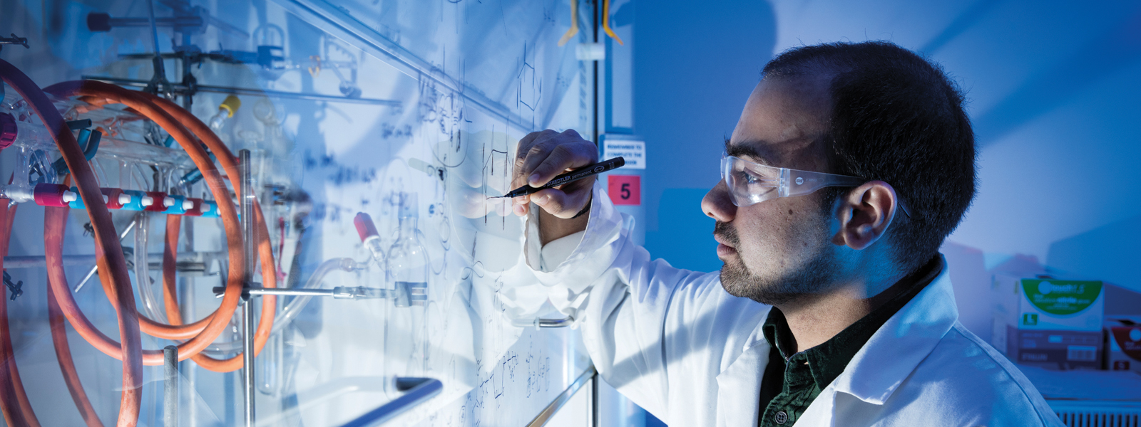 A student working in a fume cupboard