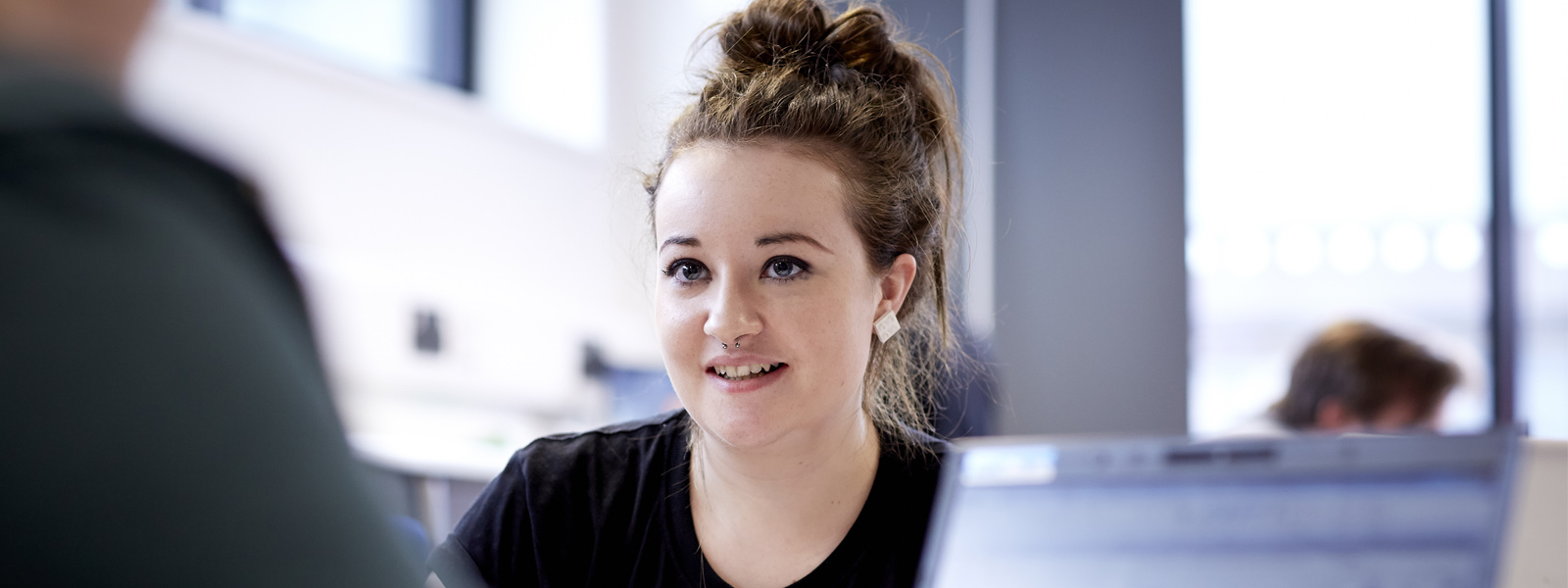 Female student talking in a classroom