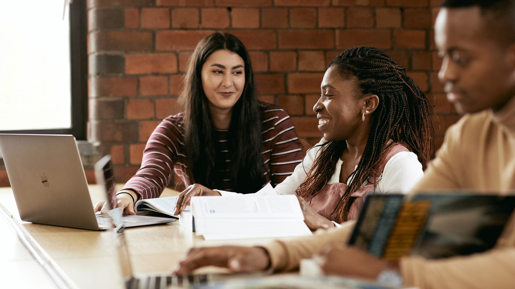 three students in the library