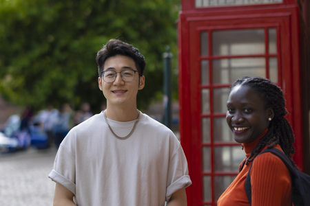 two students smiling at the camera