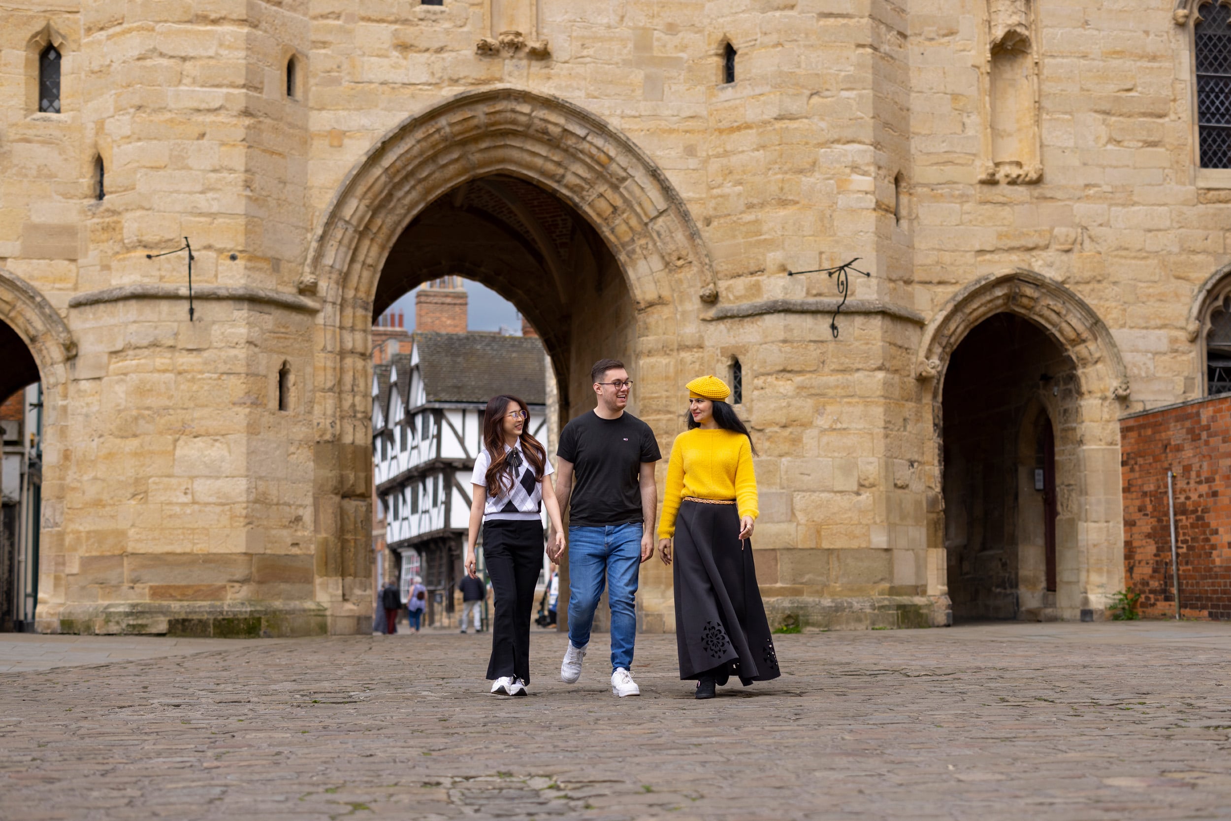 Students Walking Through Archway