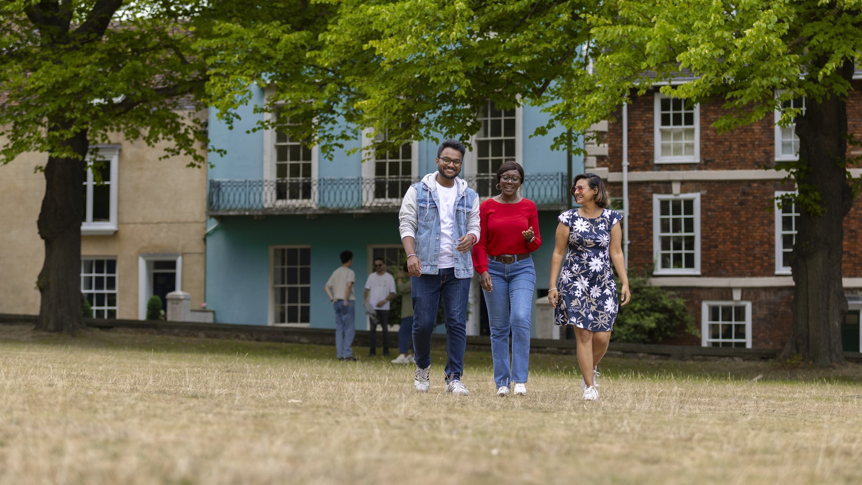 Students walking on the grass