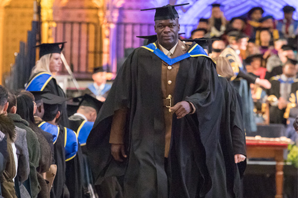 A graduate in military uniform