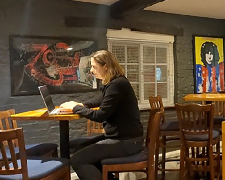 Woman sitting in a pub