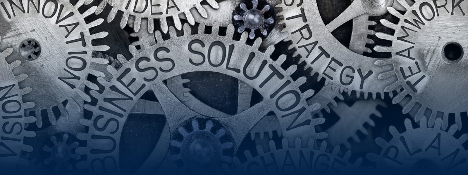 A series of cogs with business solutions, strategy, teamwork, change, and plan on