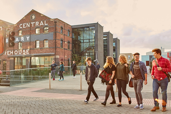 Students walking past Grand Central Warehouse library