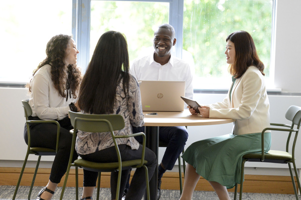 A group of students working together in a seminar room