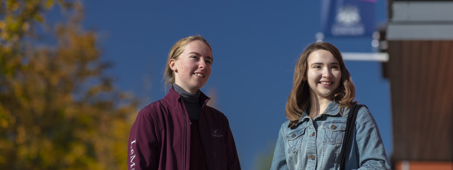 Two students outside on campus