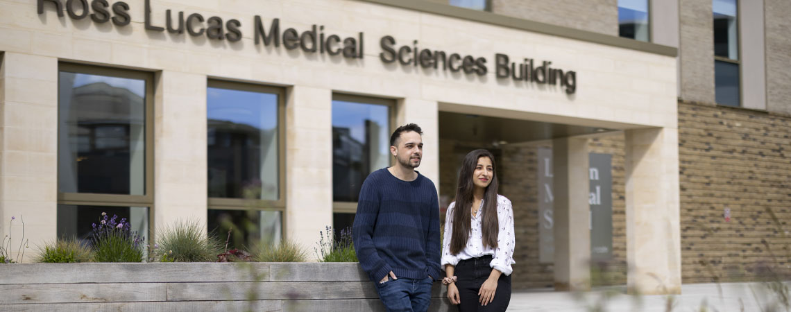 Two students standing outside the Ross Lucas Medical Sciences Building