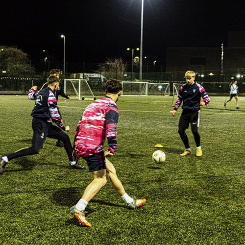 A group of students playing football