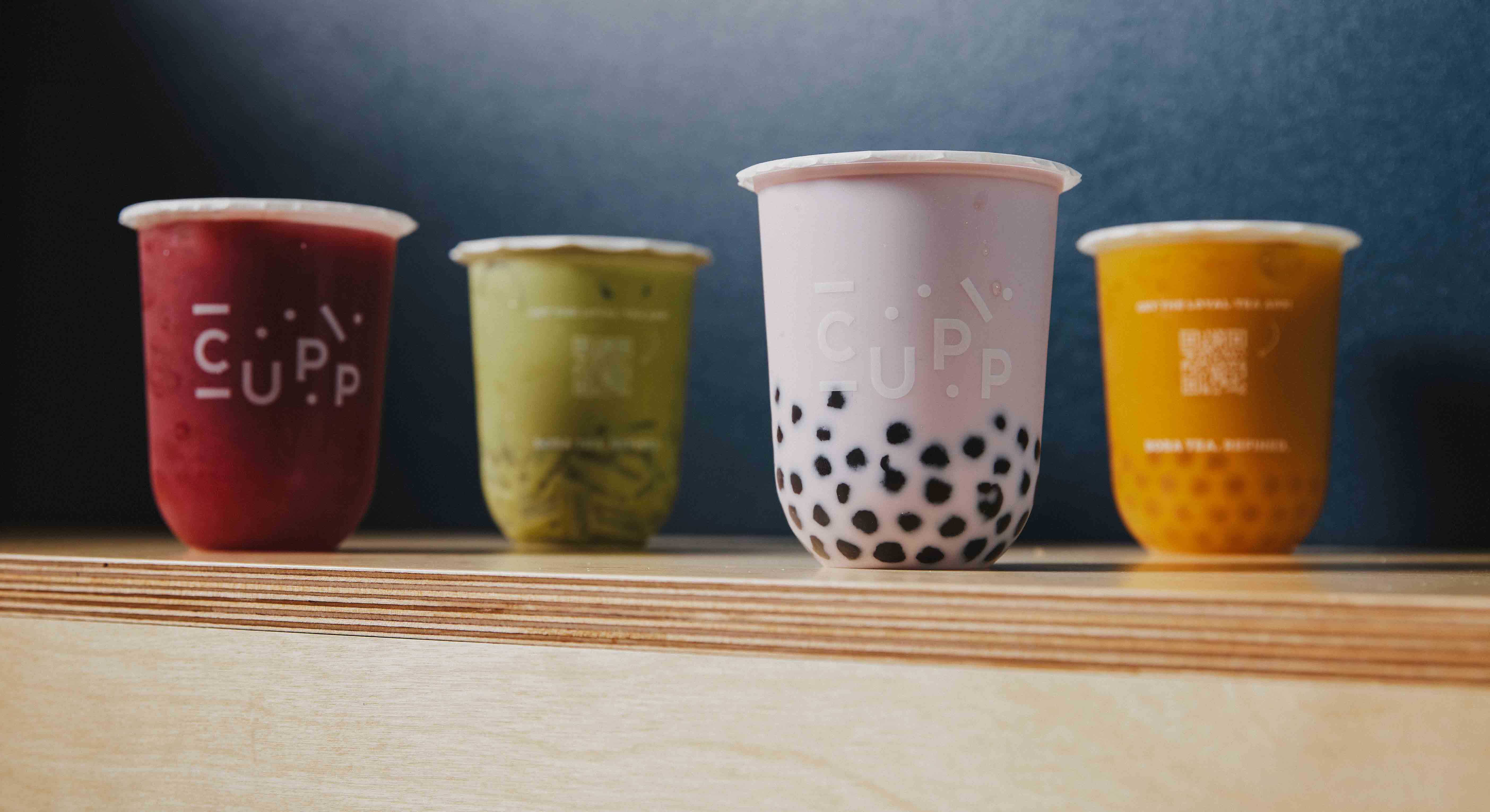 Cups of bubble tea on a shelf