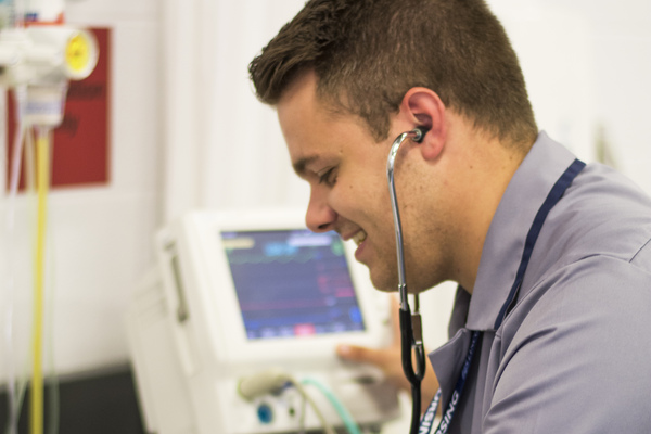 Nurse with stethoscope smiling