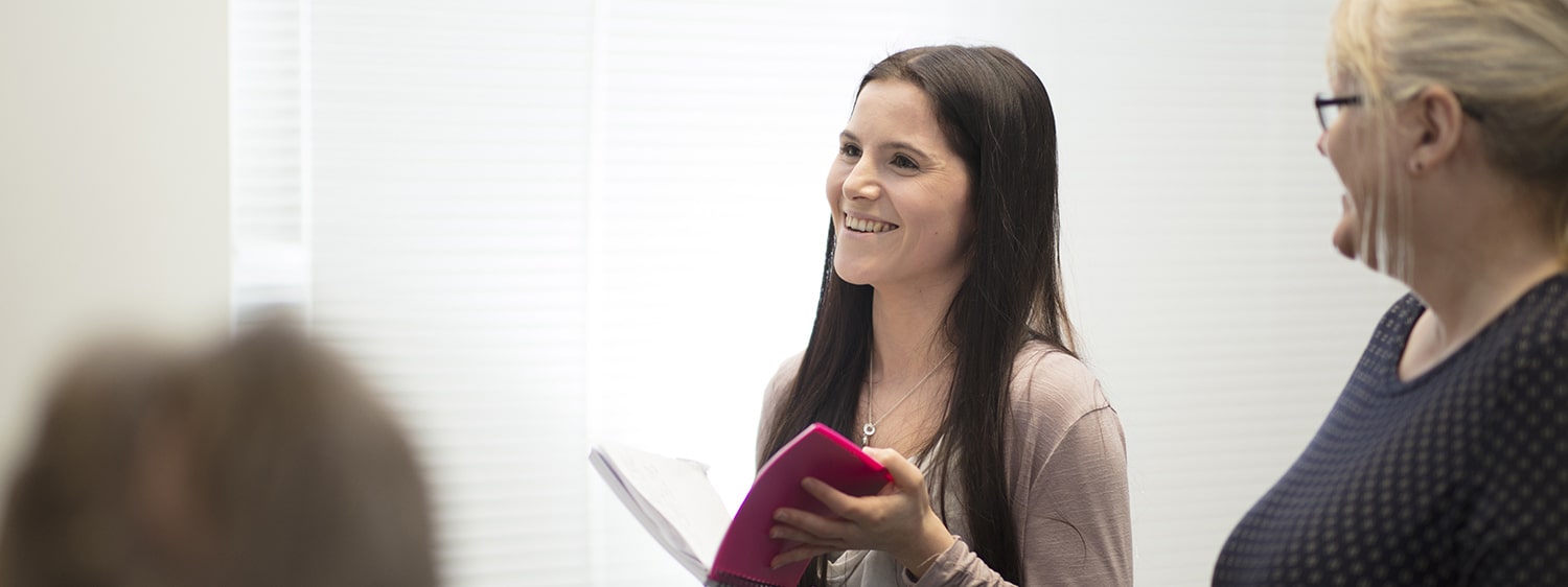 A student speaking in a seminar