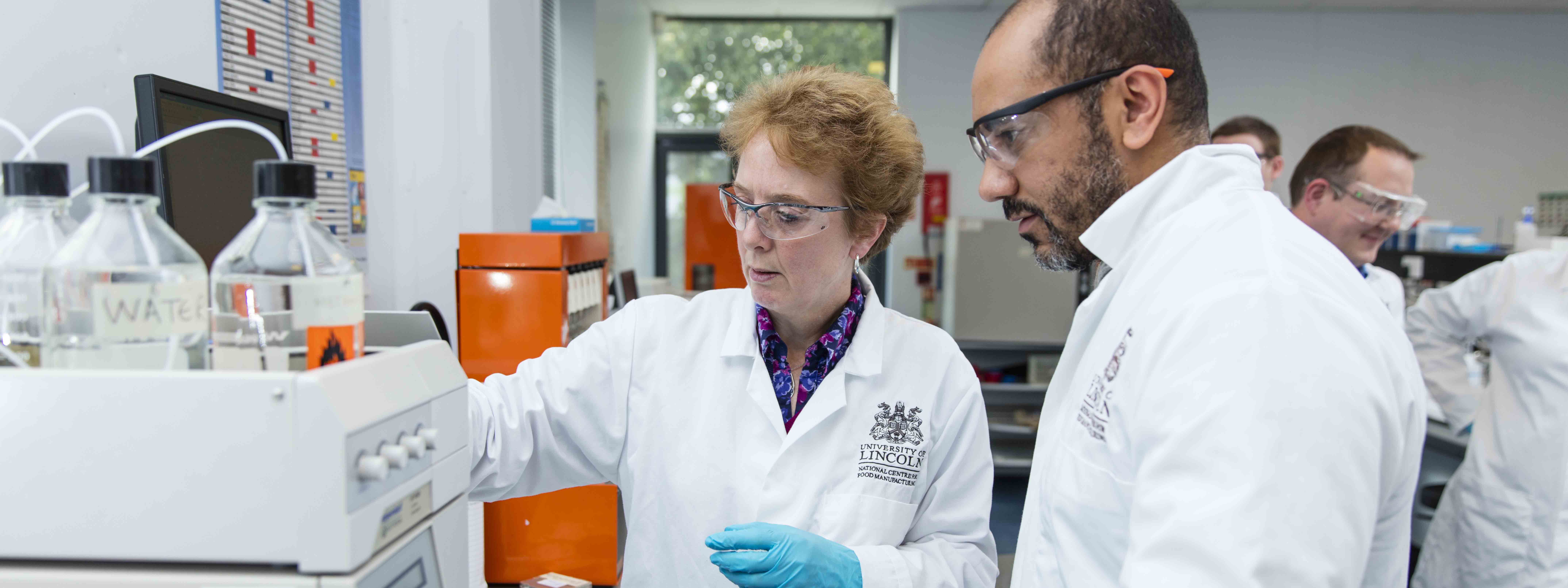 NCFM staff working in a factory